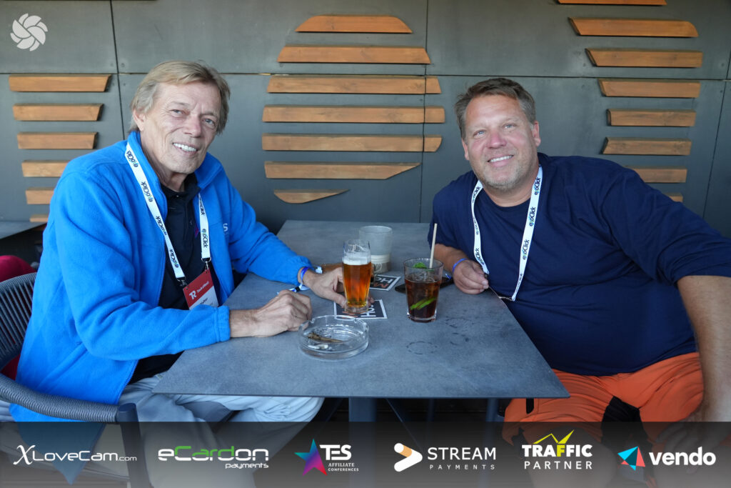 Two men sitting in a table